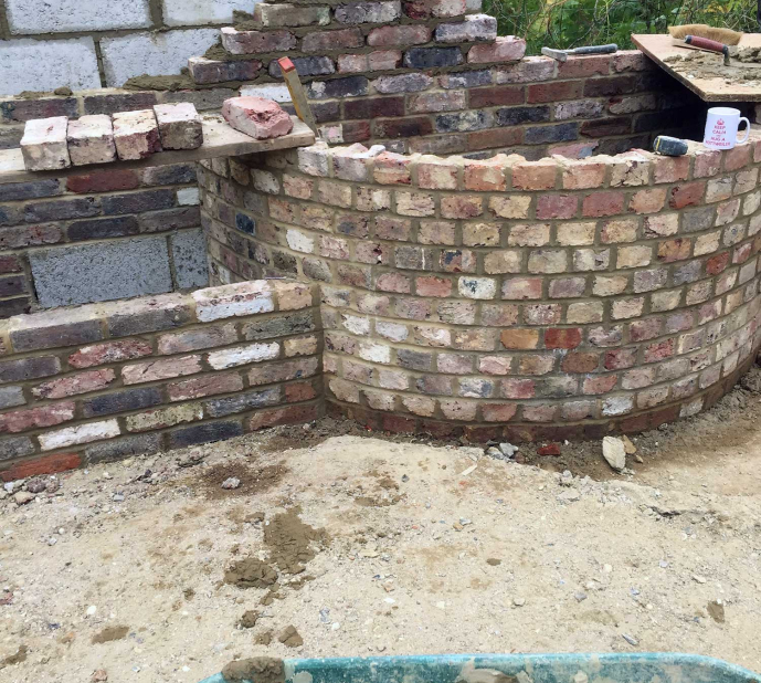 Reclaimed brick water feature and garden wall