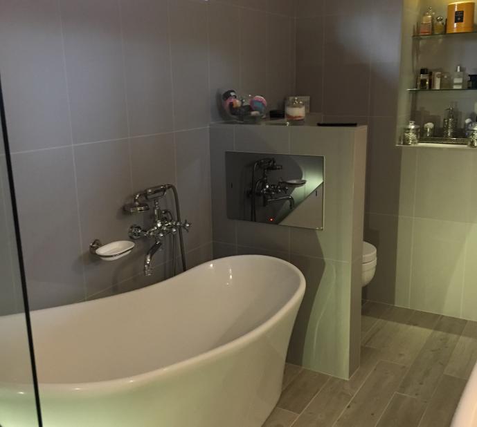 Recent wetroom/ensuite bathroom project. Fitted with waterproof Tv opposite bath, 2x showers in wetroom area, motion sensor toilet flush and perfume display. 